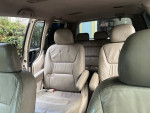 Interior view of a 2002 Honda Odyssey with leather seats and space for passengers.