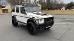 2018 Mercedes G 63 AMG in white, fully loaded with upgrades, parked in an outdoor lot.