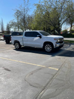 2021 Chevrolet Silverado 1500 LT 4WD parked in a lot, in pristine condition with 51,000 miles on it.