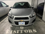 Front view of a 2015 Chevrolet Sonic LT, clean and ready for city driving, priced at $4899.