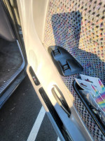Interior door panel of a 1998 Dodge Ram 1500 showing controls and fabric details
