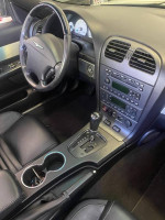 Interior view of a 2003 Thunderbird Hardtop Convertible showing the dashboard and gear shift.