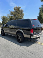 2001 Ford Excursion Limited 2WD in black with a 6-inch lift, well maintained and equipped for sale
