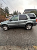 2006 Ford Escape Hybrid AWD for sale, 110,000 miles, needs engine work, great for snow with roof rack.