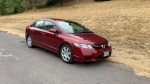 2010 Honda Civic LX in red color parked on a road with grass in the background, low mileage, clean title.
