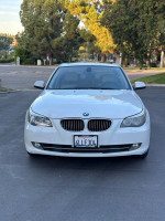 White 2010 BMW 5 Series 528i sedan parked outdoors, showing clean exterior and clear headlights.