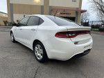 2015 Dodge Dart in white, featuring a clean design and great mileage of 109,000, parked in a lot.