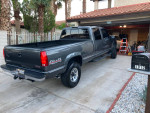 Rare 1999 GMC SLE K3500 4x4 truck with Storm Gray Metallic finish parked in driveway.