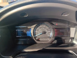 Dashboard of a 2013 Ford Escape SEL showing fuel economy and entertainment options