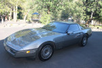 1986 Chevrolet Corvette in impeccable condition, showcasing a sleek design and parked on a sunny day