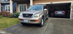 2004 Lexus GX 470 SUV parked in driveway, showcasing clean exterior and 93,000 miles on the odometer.