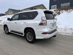 2015 Lexus GX 460 4WD luxury SUV with black leather interior parked in snowy landscape