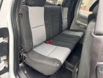 Interior view of a 2008 Chevrolet Silverado 1500 work truck rear seat, showing clean upholstery and space.