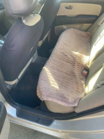 Interior view of a 2010 Hyundai Elantra showing back seat and clean upholstery.