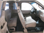 Interior of a well-maintained 2001 F150 XL with low mileage, showing clean seats and spacious cabin.