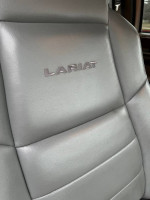 Close-up of Lariat logo on leather seat in a 2004 Ford F350 Super Duty truck.