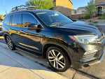 2017 Honda Pilot Elite AWD, a black SUV with dark tint, showcasing great condition and new differential.