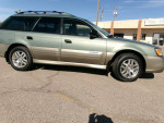 2004 Subaru Outback AWD wagon, low mileage, in great condition, showcasing all-weather package and alloy wheels.