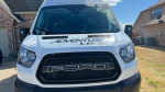 Front view of a custom 2017 Ford Transit motovan with 'Adventure Life' branding, designed for vanlife and outdoor activities.