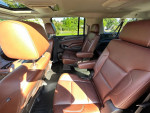 Interior of a 2015 Chevrolet Suburban LTZ showcasing luxurious Carmel leather seats.