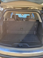 Interior view of a 2015 GMC Acadia with spacious cargo area and rear seating.