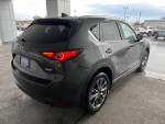 2019 Mazda CX-5 Signature rear view, featuring sleek design and raindrops on surface, available for financing.