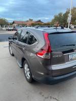 2013 Honda CR-V EX FWD parked, showing clean exterior and well-maintained condition, perfect for potential buyers.