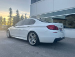 2011 BMW 535xi M-sport sedan in Alpine white with sleek design and luxury features.