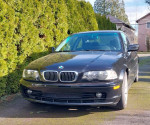 2002 BMW 325ci Coupe parked outside, well-maintained with Michelin tires, in good condition with minor sunroof issue.