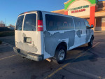 2006 Chevrolet Express 3500 passenger van with 81,000 miles, in good running condition, showing faded paint.