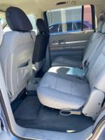 Interior view of a 2008 Chrysler Aspen showcasing spacious rear seating and upholstery in good condition.
