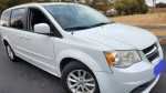 2014 Dodge Grand Caravan in white, ideal family minivan with low mileage and spacious interior.