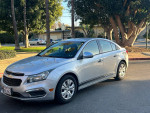 2016 Chevrolet Cruze LS in silver with 130,000 miles, featuring automatic transmission and safety airbags.