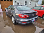 2009 Volkswagen CC in gray with a sleek design, showcasing its rain-sensing wipers and alloy wheels.