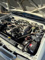 Engine bay of a Toyota Tacoma with 78,000 miles showcasing maintenance and features.