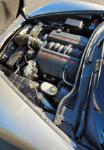 Engine bay of a 2005 Chevrolet Corvette with low mileage and performance upgrades