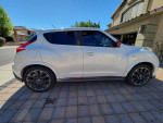 Side view of a white Nissan Juke Nismo, 6-speed manual, clean condition with 109,000 miles.