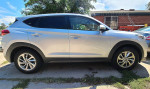 Side view of a 2018 Hyundai Tucson in perfect condition, parked near 8th and Xavier St.