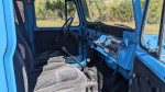 Interior view of a 1977 Toyota Landcruiser BJ40 with a 5-speed transmission and upgraded features.