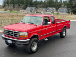 1997 Ford F250 7.3 Powerstroke truck in red with 4WD, low mileage, well-maintained, perfect for off-road adventures.