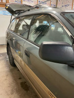 2002 Subaru Outback with manual transmission, low mileage, and good condition, showcasing exterior details