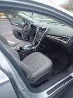 Interior view of a 2016 Ford Fusion S FWD showing spacious seating and modern infotainment system.