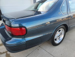 1996 Chevrolet Impala in excellent condition with original paint and leather seats, showcasing its iconic design.