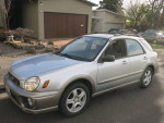 2003 Subaru Impreza Outback Sport in silver, showcasing clean exterior and all-wheel drive features.