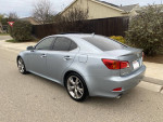 2010 Lexus IS 250 RWD in silver, parked on the street, showcasing clean exterior and luxury features.