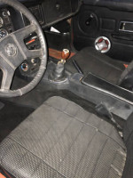 Interior view of a low-mileage 1980 MG convertible with a manual transmission and custom shifter.