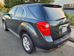 2012 Chevrolet Equinox LS in excellent condition with low mileage, power features, and Bluetooth, parked outdoors.