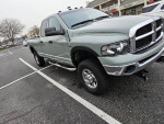 2003 Dodge Ram 2500 Diesel truck, fully restored with new paint, tires, and transmission in parking lot.