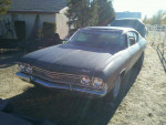 1968 Chevrolet Chevelle project car with a strong V8 engine and surface rust, parked outdoors.