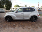 2006 Chrysler PT Cruiser GT in silver with leather interior and 17-inch wheels, parked on a brick driveway.
